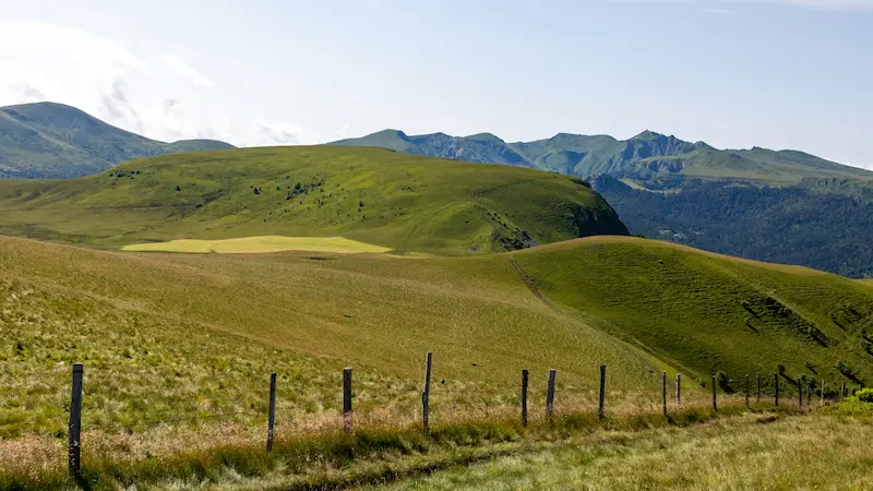 Rolling volcanic hills and green plateaus in the Auvergne Massif Central, France digital detox retreat destination in Europe